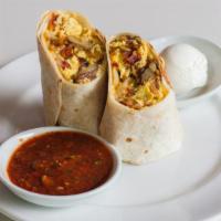 Breakfast Burrito · A scramble of eggs, onions, bell peppers, potatoes, cheese, crumbled sausage or diced ham or...