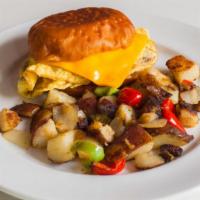 Frost Signature Breakfast Sandwich · 2 scrambled eggs, sausage, ham or bacon, with American cheese sandwiched between a grilled d...