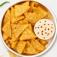 Chips & Queso Love Story · Plain chips with queso dip on the side.
