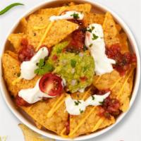 Los Loaded Nachos · Warm nachos topped with beans, guacamole, sour cream, tomatoes, and onions.