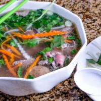 #44. Pho (Large) · Choice of any combination of rare thin sliced steak, well done steak, beef tendon, tripe and...