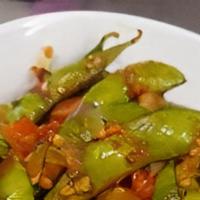 Garlic Edamame  · Gluten free , edamame tossed in roasted chilli and garlic in chopped bell pepper and onions ...