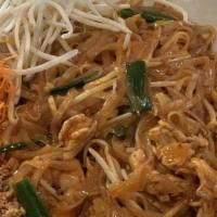 Pad Thai · Stir-fried rice noodles with egg, green onion, bean sprouts, topped with ground peanuts.  Pl...