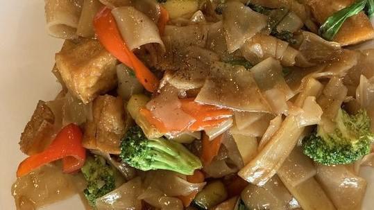 Drunken Noodle · Chicken, beef, or pork in a basil and Thai pepper base with broccoli, carrots, zucchini, bamboo shoots, red bell peppers, and soy sauce.