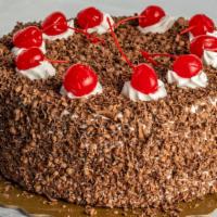 Black Forest  · Chocolate cake with custard cream filling and bing cherries. decorated with fresh whipping c...