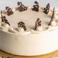 Mocha Cake · Vanilla sponge cake layered with fresh mocha whipping cream. Decorated with chocolate tags.