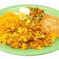 Huevos Con Chorizo · Mexican sausage mixed with scrambled eggs served with rice, beans, lettuce, pico de gallo, a...