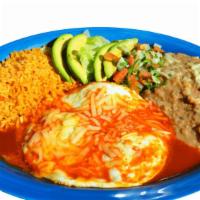 Huevos Rancheros · 3 over hard eggs served with red salsa and melted cheese on top with rice, beans, lettuce, p...