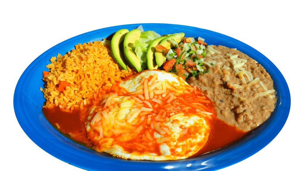 Huevos Rancheros · 3 over hard eggs served with red salsa and melted cheese on top with rice, beans, lettuce, pico de gallo, sour cream, and your choice of homemade corn tortilla or flour tortilla.