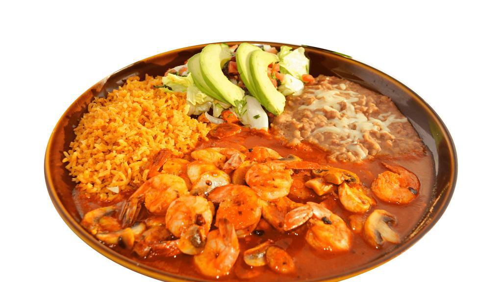 Camarones A La Diabla · Shrimp cooked in spicy house red sauce served with mushrooms, rice, beans, avocado, pico de gallo, lettuce, and your choice of homemade corn tortilla or flour tortilla.