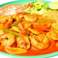 Camarones Rancheros · Shrimp in mild red salsa served with green and red bell peppers, rice, beans, lettuce, pico ...