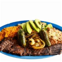Carne Asada · Mexican style charbroiled beef steak served with pico de gallo, lettuce, avocado, rice, bean...