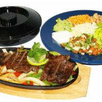 Fajitas Plate · Fajitas with your choice of veggie, chicken, or shrimp and served with bell peppers, beans, ...