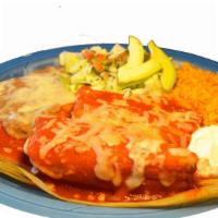 Tamales Plate · Seasoned meat served with rice, refried beans, lettuce, sour cream, pico de gallo, and sauce...
