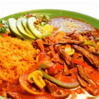 Steak Ranchero · Strips of charbroiled steak with sautéed mushrooms with onions and bell peppers covered in a...