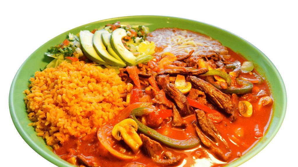 Steak Ranchero · Strips of charbroiled steak with sautéed mushrooms with onions and bell peppers covered in a mild sauce. Served with your choice of homemade corn tortillas or flour tortilla.