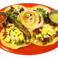Tacos · 1 taco served with onions, cilantro, and your choice of meat. Comes with your choice of home...