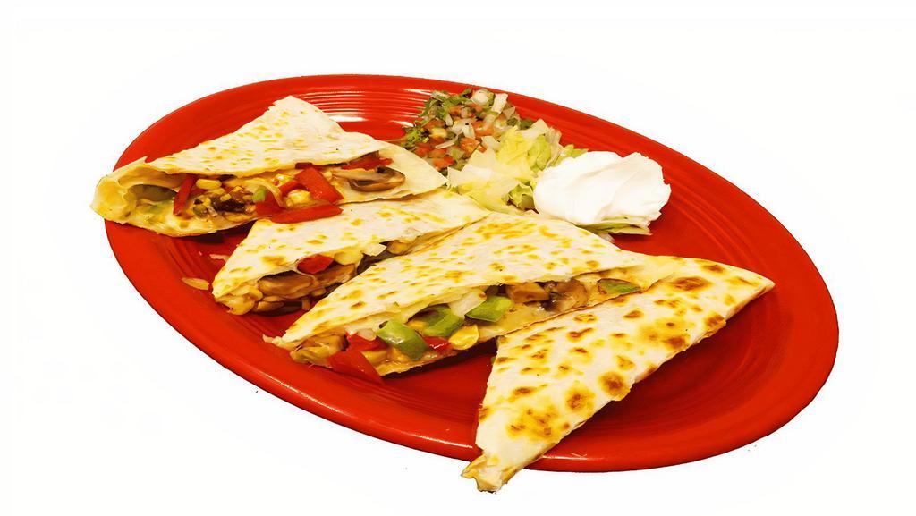 Veggie Quesadilla · Flour tortilla served with onions and bell peppers, mushrooms, corn, pico de gallo, lettuce, and sour cream.