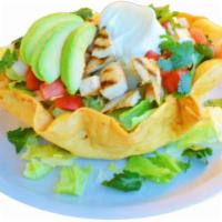 Taco Salad · Hard tortilla served with lettuce, pico de gallo, avocado, and sour cream. You may add meat ...