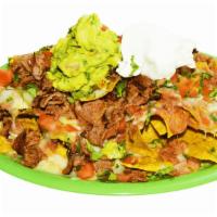 Meat Nachos · Crispy nachos served with melted cheese, refried beans, pico de gallo, sour cream, guacamole...