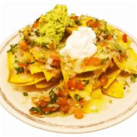 Nachos Without Meat · Crispy nachos served with melted cheese, refried beans, pico de gallo, sour cream, and guaca...