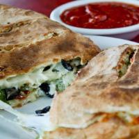 Riccis Calzone · Pepperoni, sausage, mushrooms, black olives, green peppers and onions.