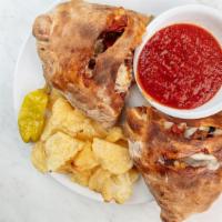 All Meat Combo · Filled with ricotta, mozzarella, Parmesan and house-made red sauce. Served with chips and a ...