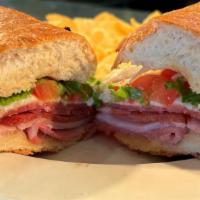 Ricci'S Hero · Ham, salami, capicola, melted provolone, topped with lettuce, tomatoes, and oil & vinegar.