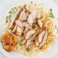 Chicken Fettuccine Alfredo · Fettuccine pasta covered in our house-made alfredo sauce then topped with a sliced breaded c...