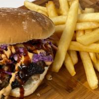 Sandwiches · Piled high with your choice of Texas Style BBQ meat, topped with our Slaw, drizzled with BBQ...