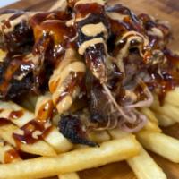 Loaded Fries · Fries topped with Green Chili  Mac  and your choice of Texas Style BBQ meat, then drizzled  ...