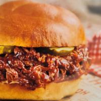 Bbq Pulled Pork Sandwich · Hearty Sandwich is served on our Baker's Roll and topped with our sweet and tangy BBQ Pulled...