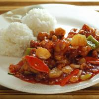Sweet And Sour Chicken · Classic Chinese Sweet and Sour Chicken, topped with toasted sesame seeds. Served with two sc...