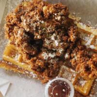 Classic · Our waffle topped w/buttermilk fried chicken and a side of syrup.