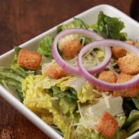 Side Caesar Salad · Romaine, parmesan, red onion and croutons.  Served with Caesar dressing.
