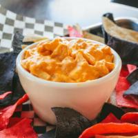 Buffalo Chicken Dip · A spicy treat served with tortilla chips.