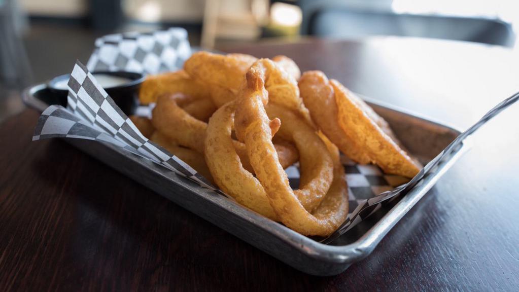 Onion Rings · Beer battered onion rings served with ranch or Cajun horseradish dipping sauce.