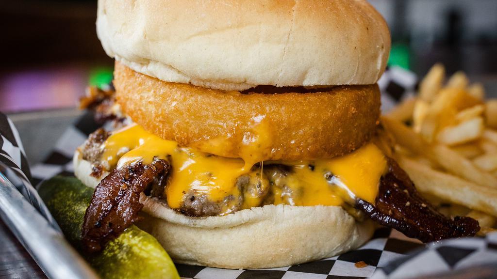 Wild Hog Burger · BBQ sauce, two strips of peppered bacon, onion ring, and American cheese.