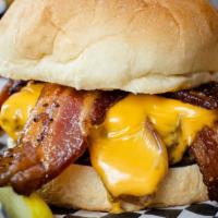 Bacon Lovers' Burger · Two crispy strips of peppered bacon wrapped around our seared burger patty. Add on two slice...