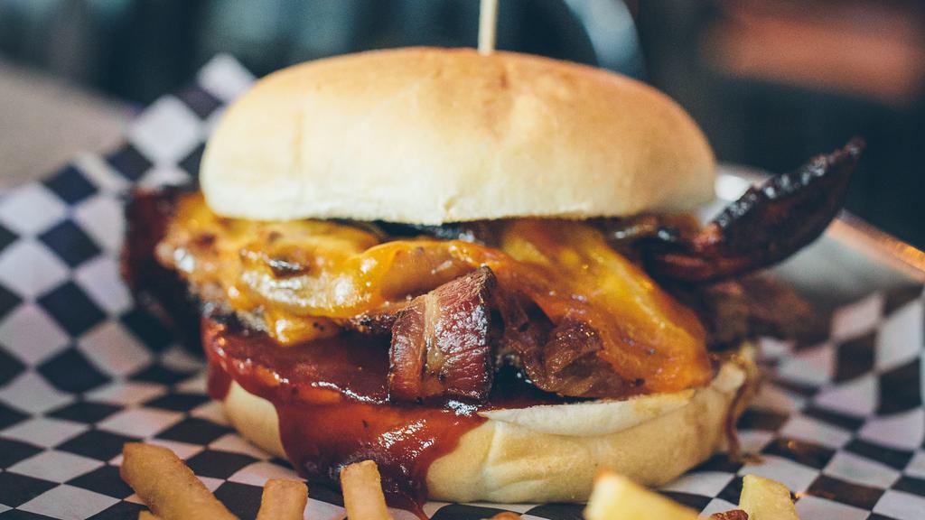 Jameson Burger · Jameson whiskey BBQ sauce, sauteed onions, cheddar cheese, and peppered bacon.