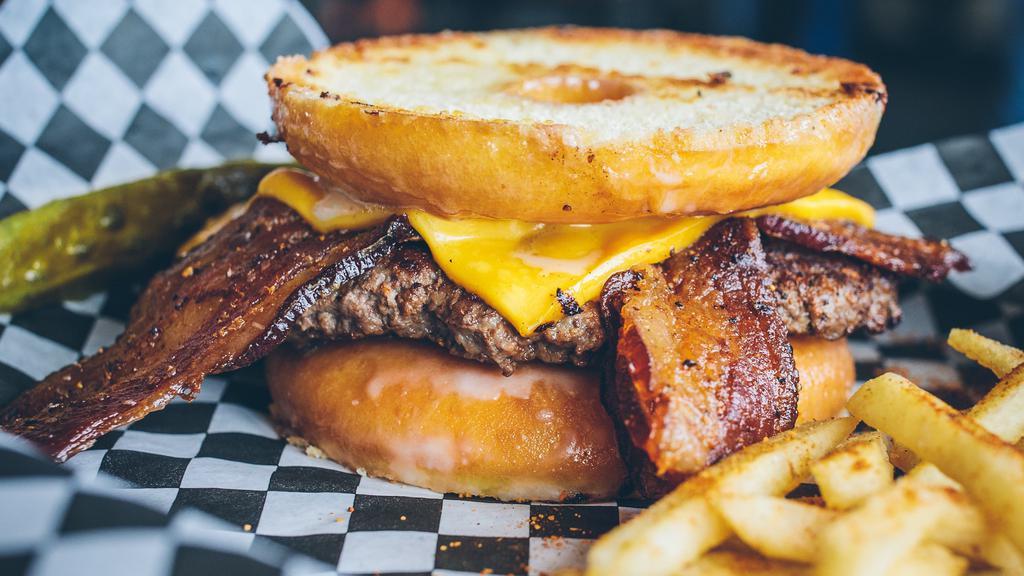 Glazed Doughnut Burger · We use a glazed doughnut bun, American cheese, and peppered bacon.