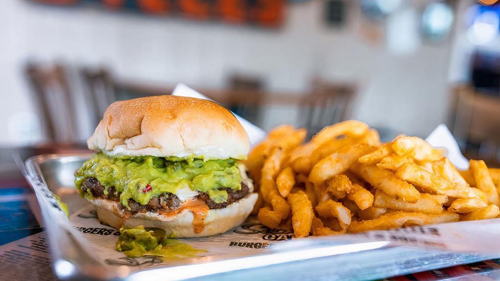 Guac And Roll · For those about the guac, we salute you. Juicy burger topped with fresh guacamole, jalapeños, pepper jack cheese, and spicy OH YEAH sauce.
