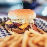 Eggstraordinary Burger · Fried egg, two strips of peppered bacon, and American cheese.