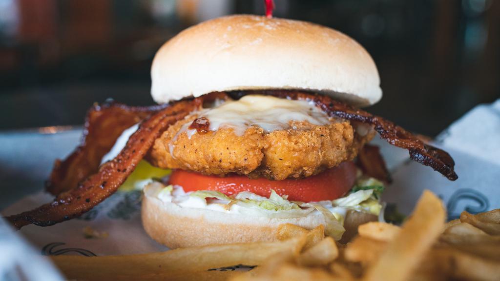 Crispy Chicken Ranch · Breaded and fried chicken breast topped with Asiago cheese, peppered bacon, lettuce, tomato, and creamy ranch dressing.