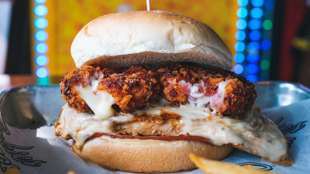 Chicken Cordon Bleu · Grilled chicken breast topped with Swiss cheese, sliced ham, a smashed ham and cheese ball, and honey mustard.