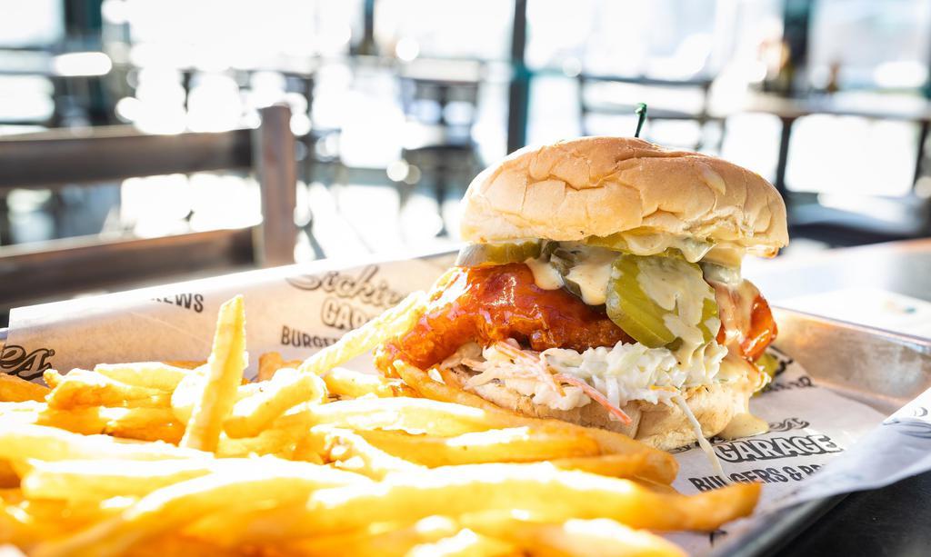 Hot Honey Chicken Sandwich · Breaded and fried chicken breast topped in our Hot Honey Sauce on creamy coleslaw, topped with honey mustard and pickles.