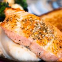 Grilled Salmon Dinner · Atlantic salmon seared and topped with garlic butter. Served with mashed potatoes and a side...
