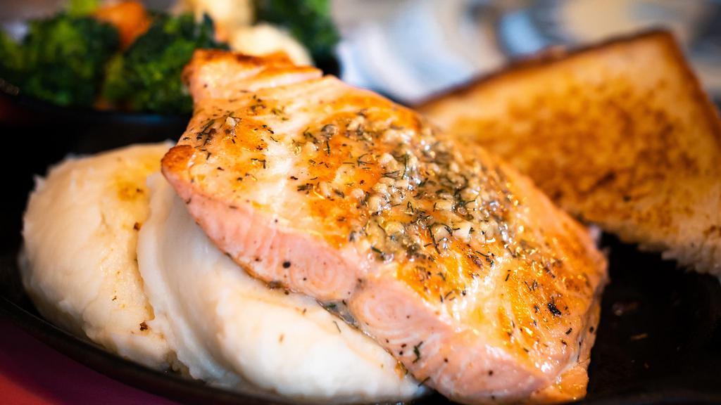 Grilled Salmon Dinner · Atlantic salmon seared and topped with garlic butter. Served with mashed potatoes and a side of hot veggies in our house-made garlic butter sauce.