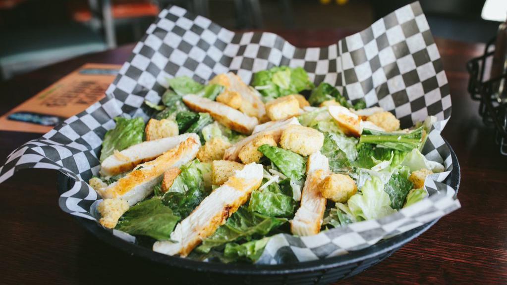 Chicken Caesar Salad · Classic bed of fresh romaine lettuce, grilled chicken, shredded parmesan cheese, garlic croutons, and own caesar dressing.