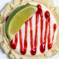 Swizzle Sugar Cookie · Coconut frosting, raspberry drizzle and fresh lime.
